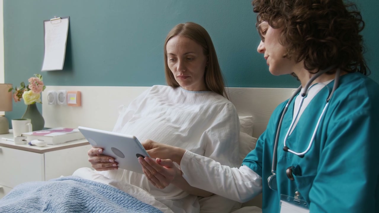 Pregnant Woman Views Ultrasound on Tablet