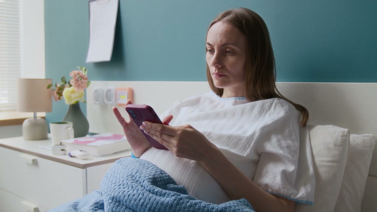 Pregnant Patient Using Phone in Maternity Ward