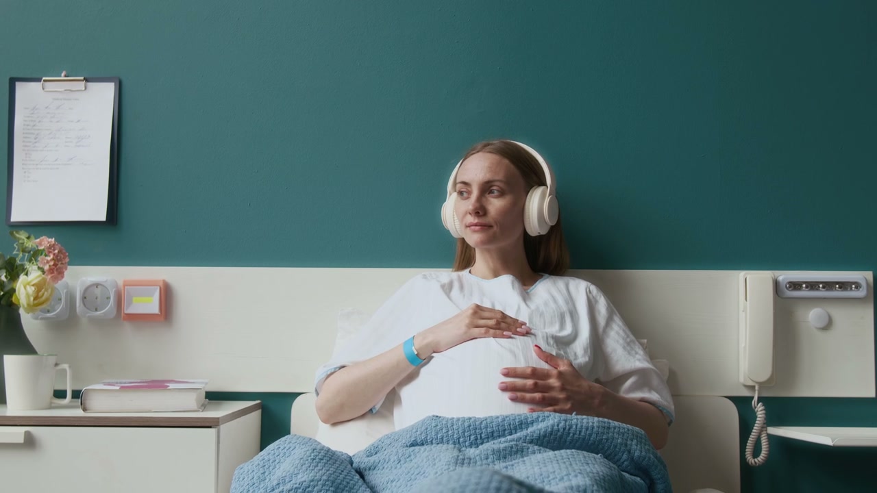 Pregnant Woman Relaxing in Hospital Bed