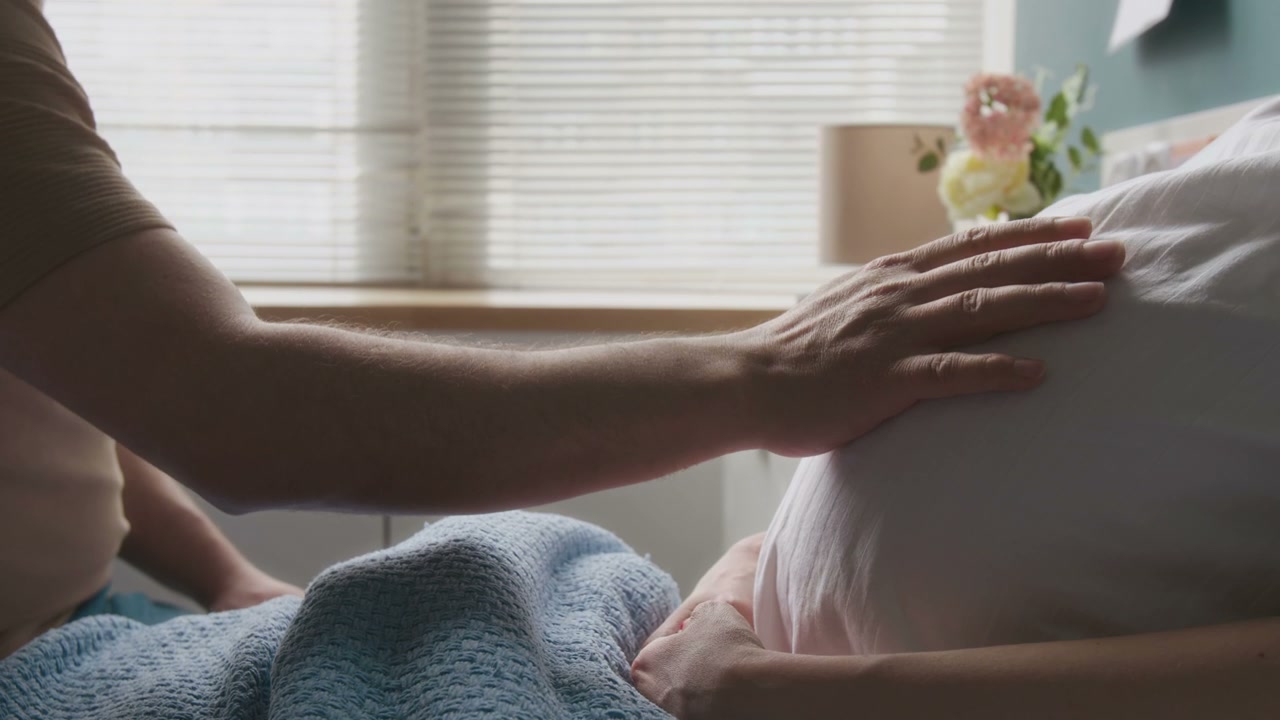 Couple Gently Caressing Pregnant Belly