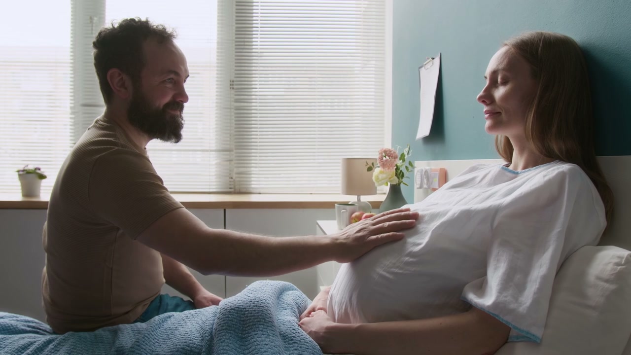 Expectant Parents Share Tender Moment