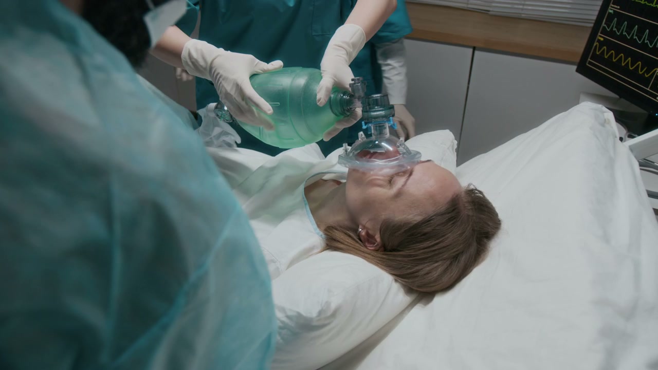Medical Team Administering Oxygen to Patient