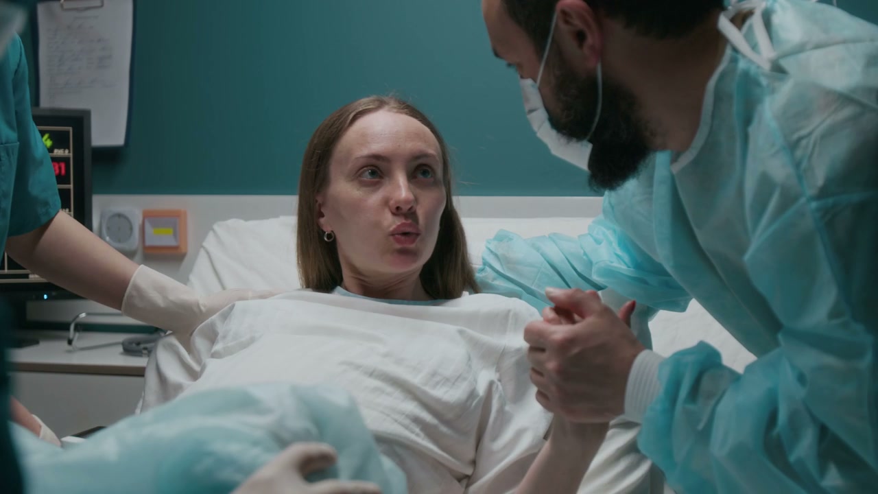 Woman Pushing During Childbirth in Hospital