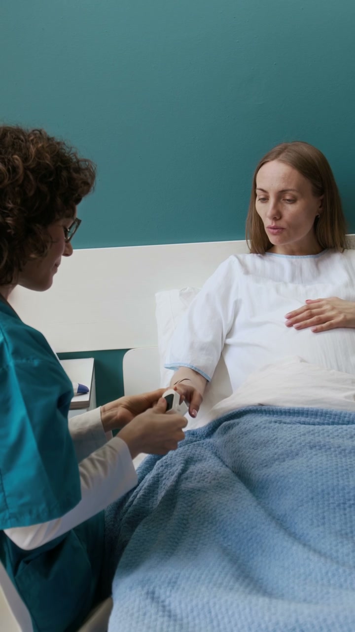 Nurse Checks Pregnant Woman's Vitals