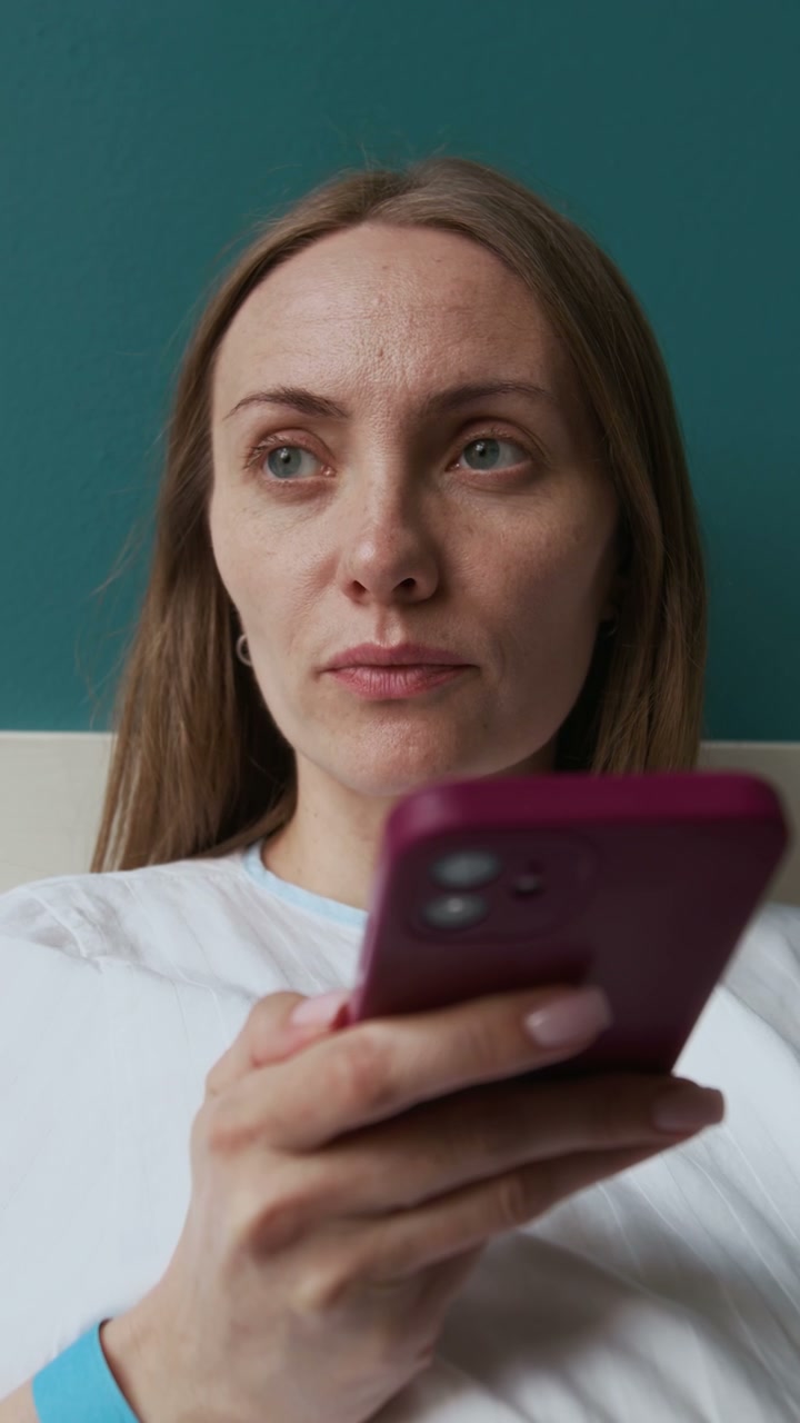 Pregnant Woman Recording Voice Message in Hospital