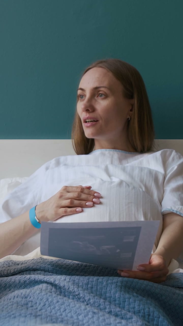 Pregnant Woman Talking with Ultrasound Scan