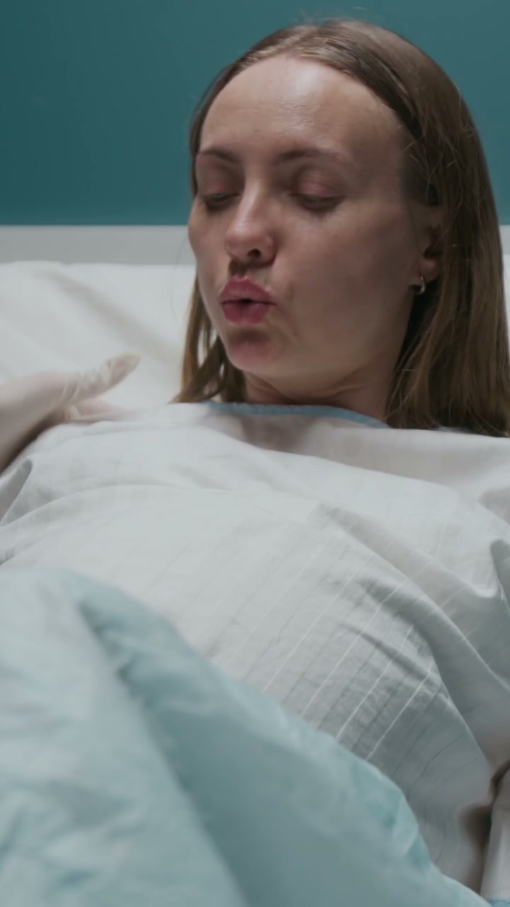 Pregnant Woman Pushing in Hospital Labor Room