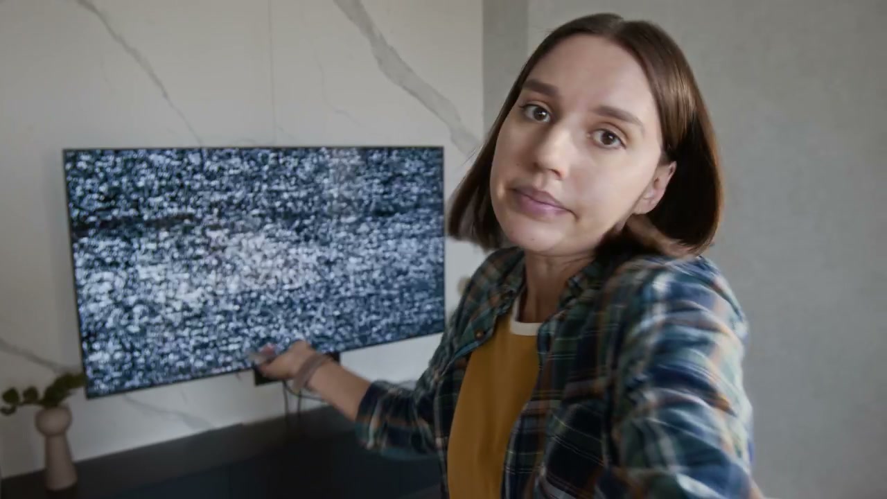 Woman Explaining Static TV Problem on Video Call