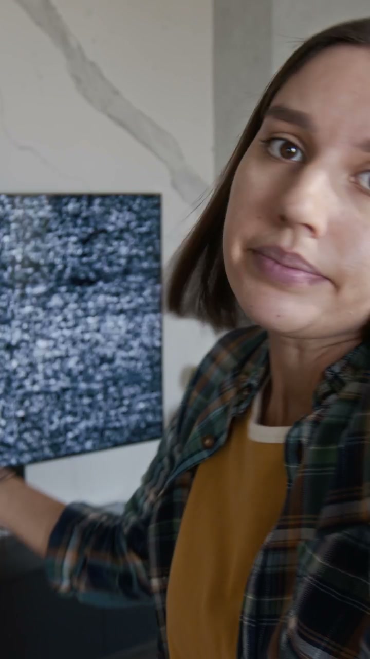 Woman Reporting Broken TV Static Screen