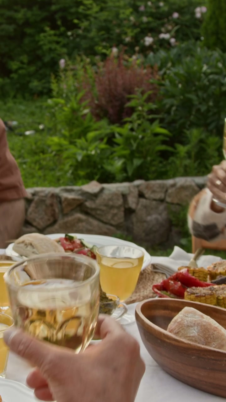 Family Toasting During Outdoor Lunch