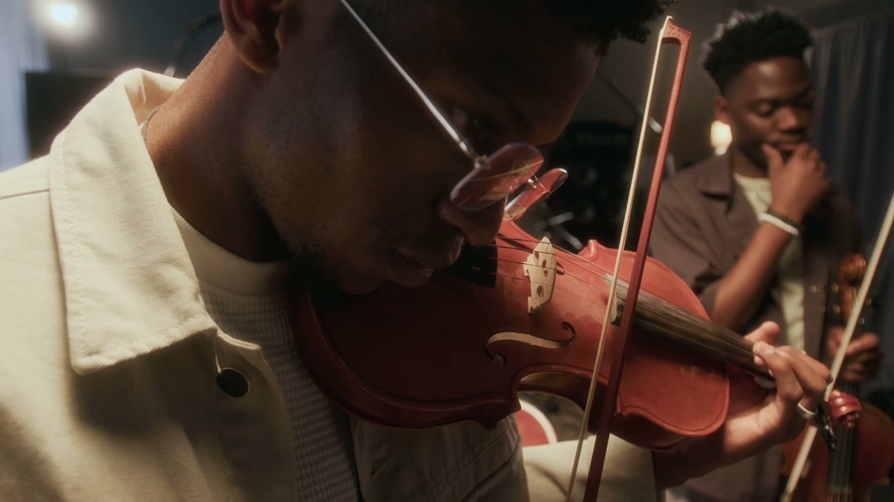 Musicians Playing Violins in Studio