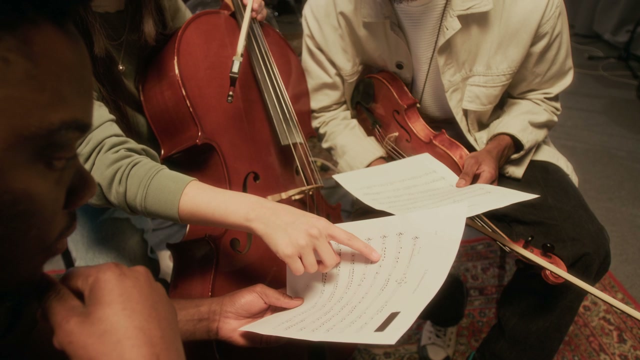 String Musicians Discussing Music