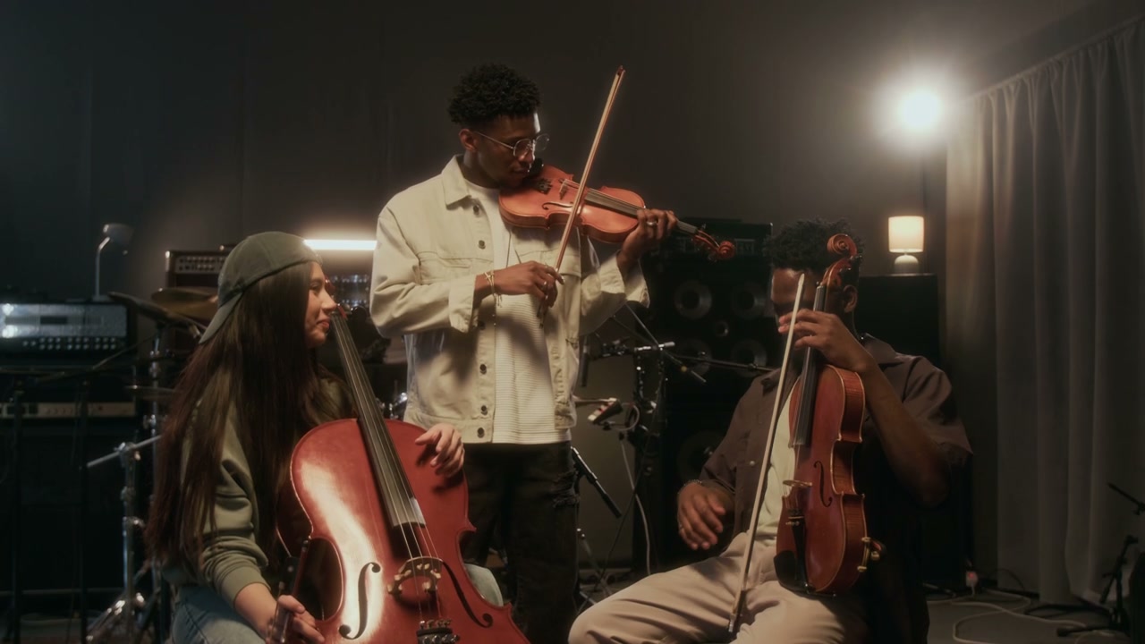 String Trio Practicing Music in Studio