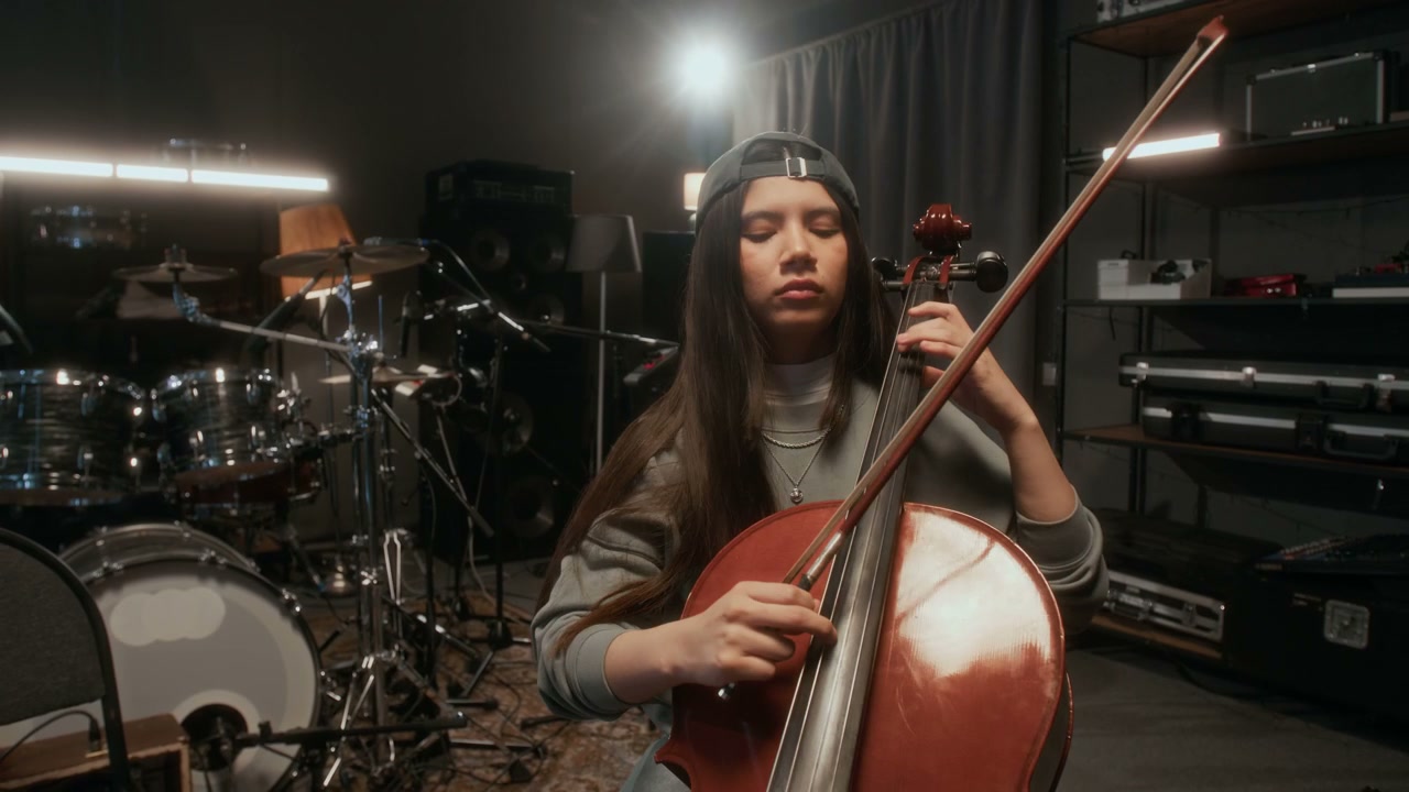Cellist Playing in Music Studio