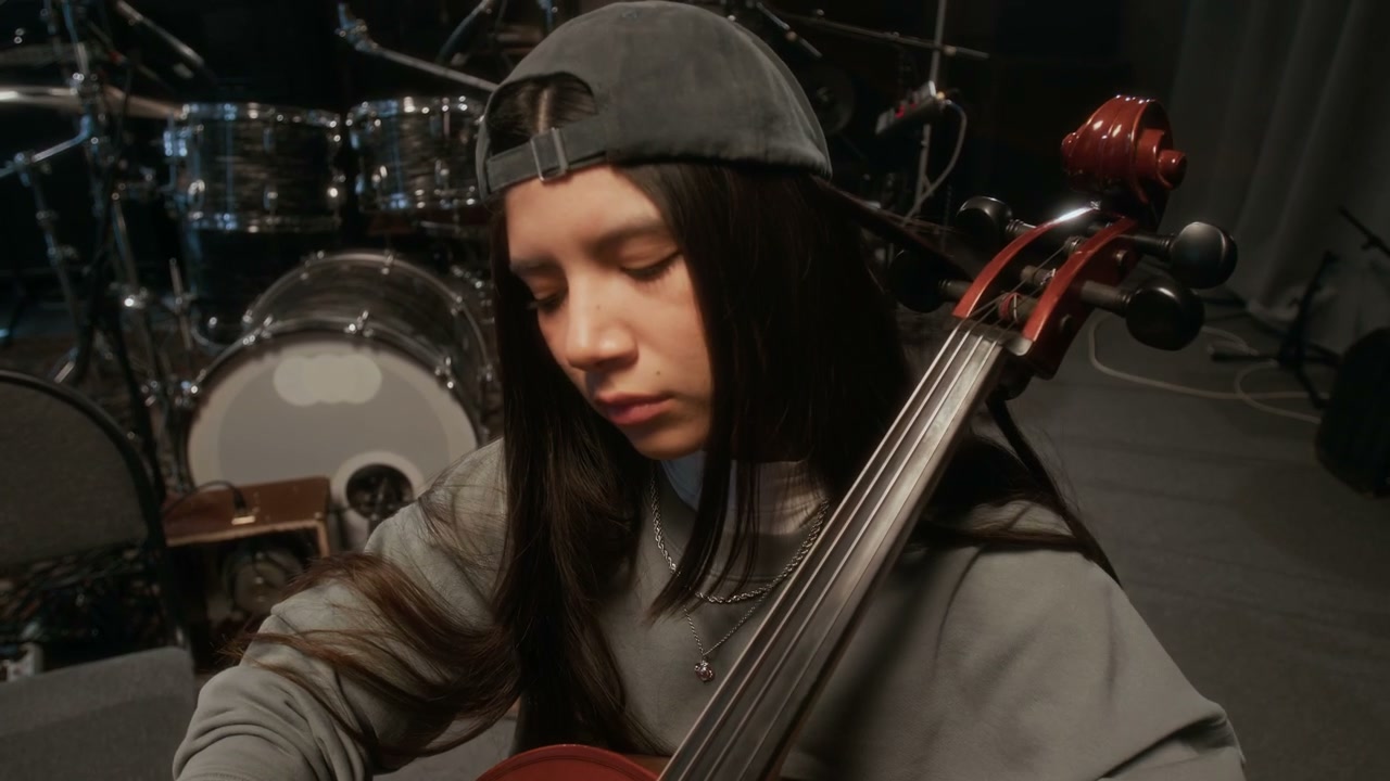 Young Cellist Practicing in Studio