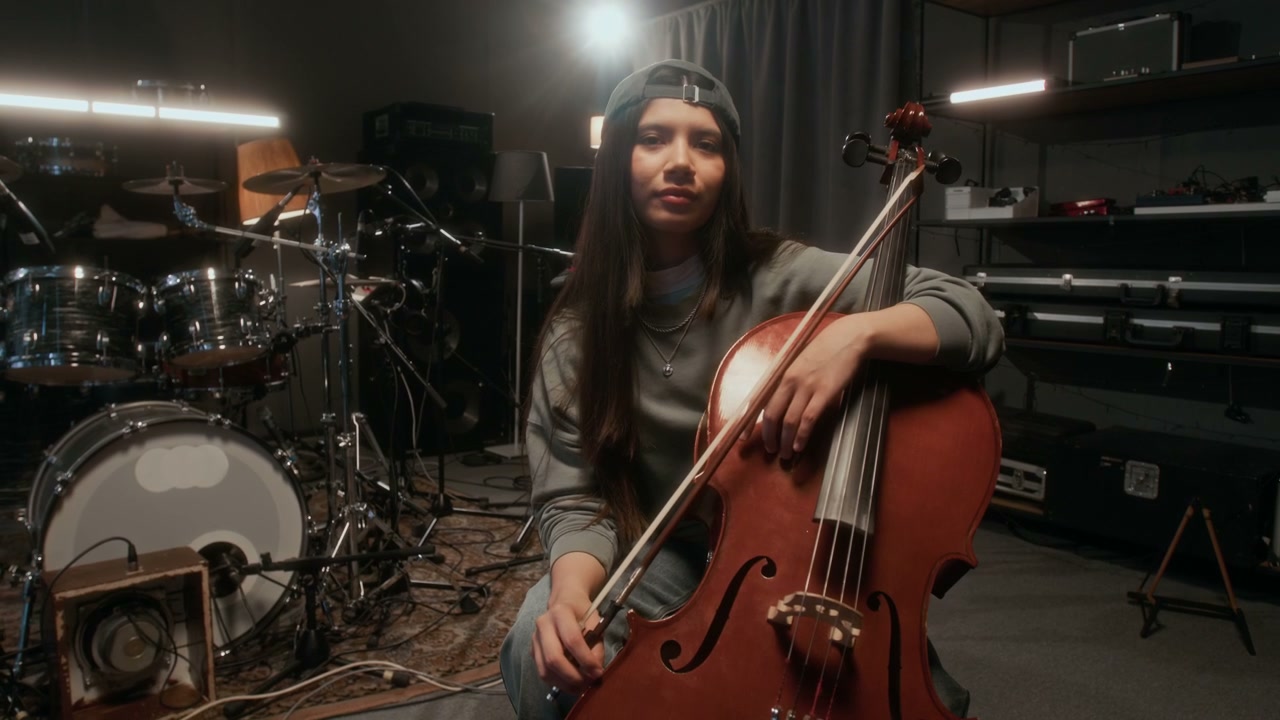 Woman Cellist Posing in Music Studio