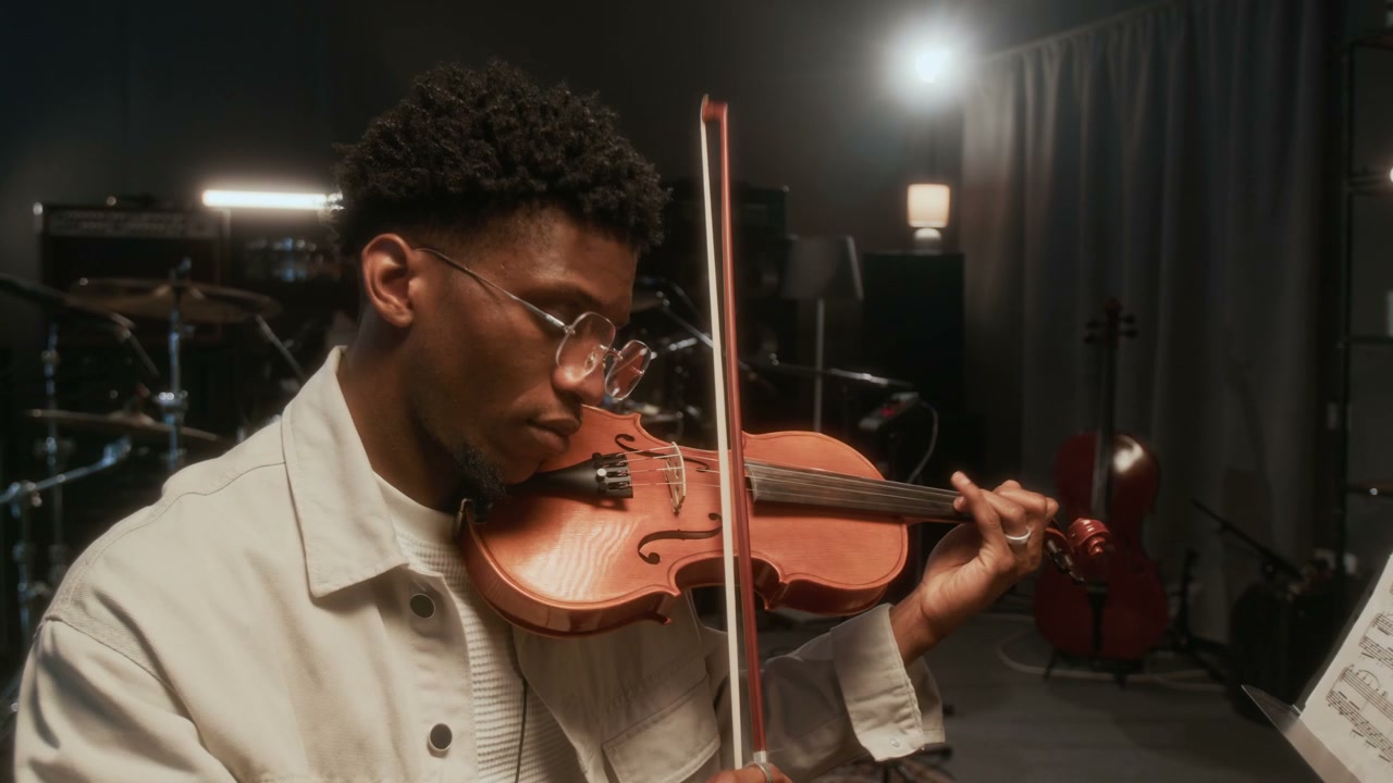 Musician Playing Violin in a Recording Studio