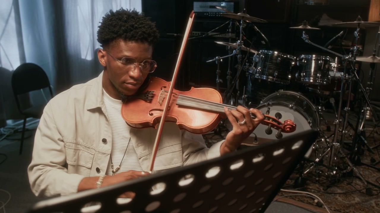 Young Man Playing Violin in Studio