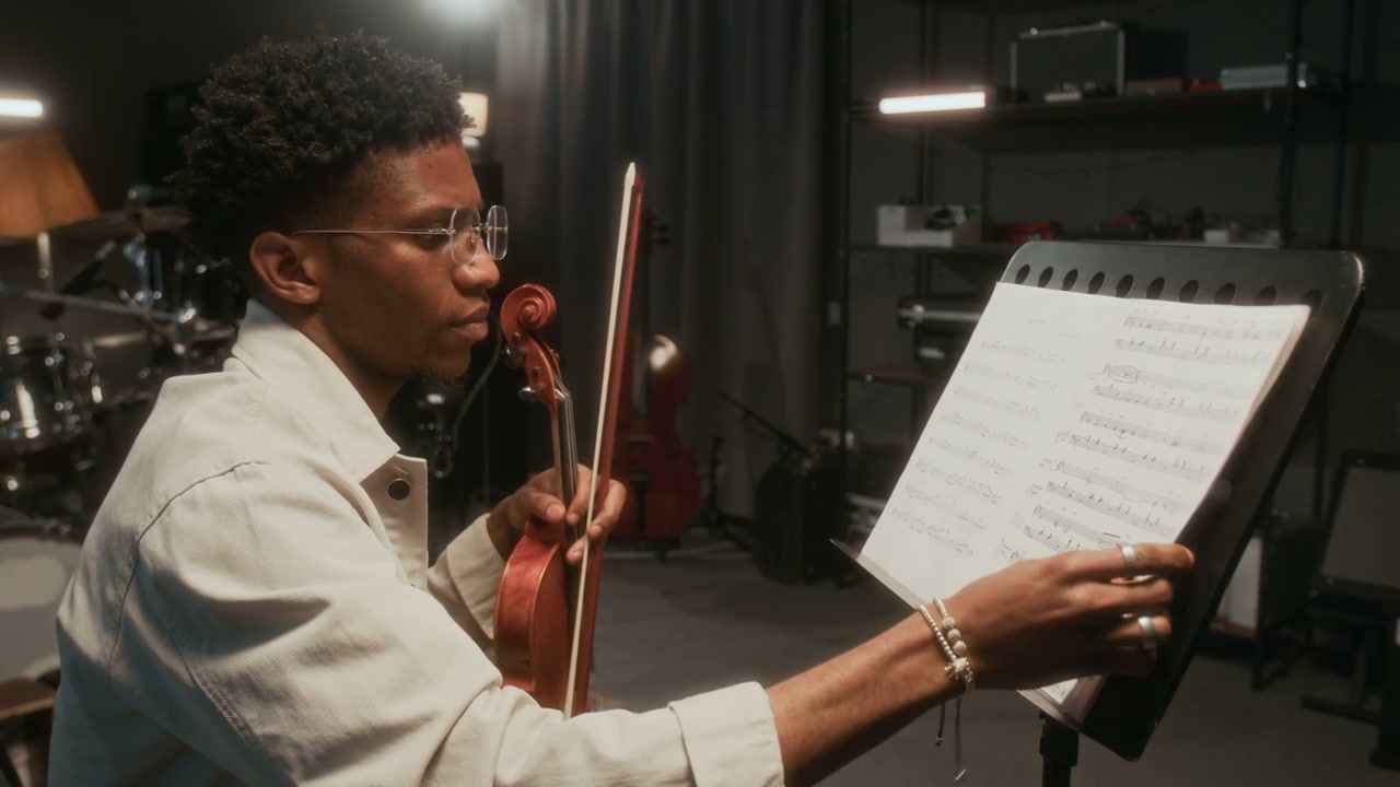 Musician Reading Sheet Music for Violin