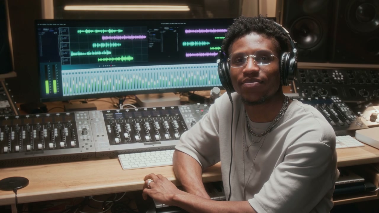 Smiling Music Producer in Recording Studio