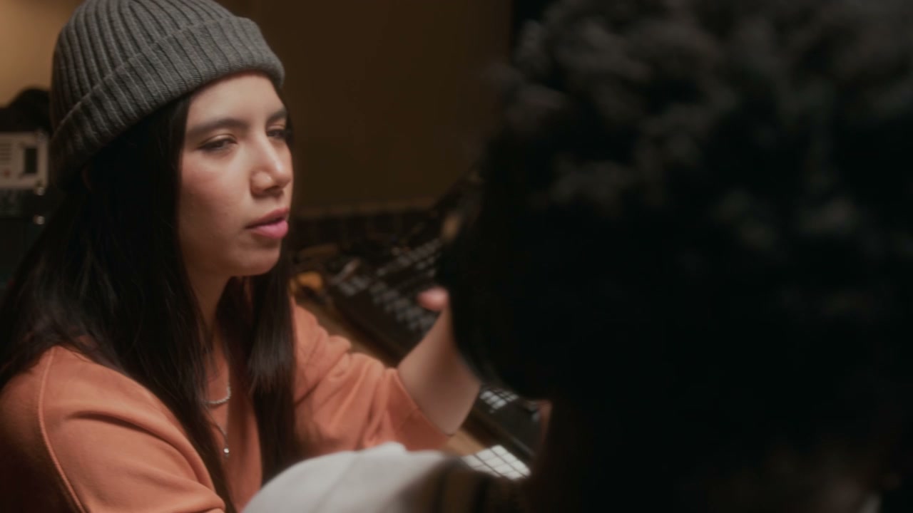 Music Producers Working in Recording Studio