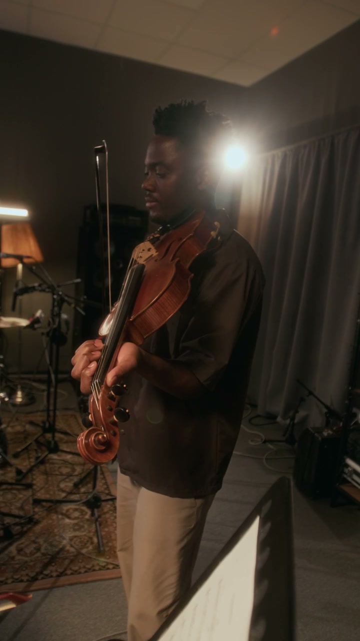 Man Playing Violin in Recording Studio