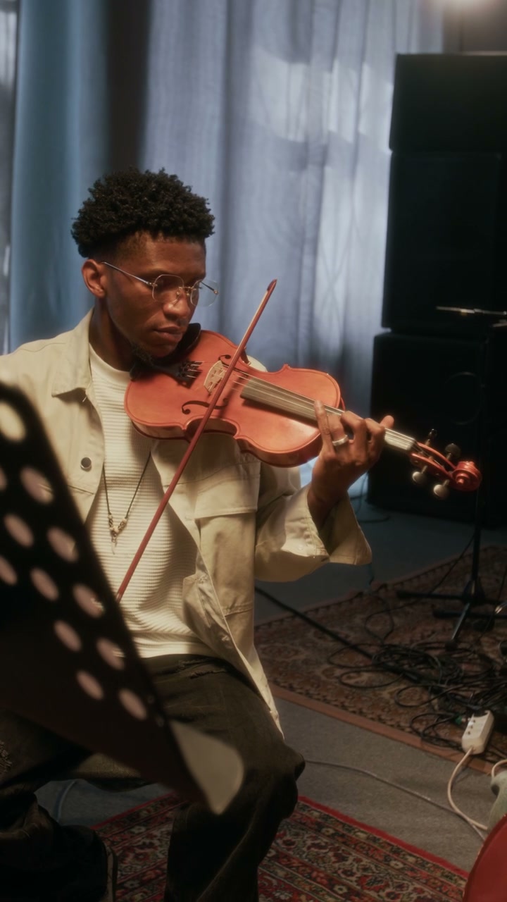 Young Musician Playing Violin in Studio