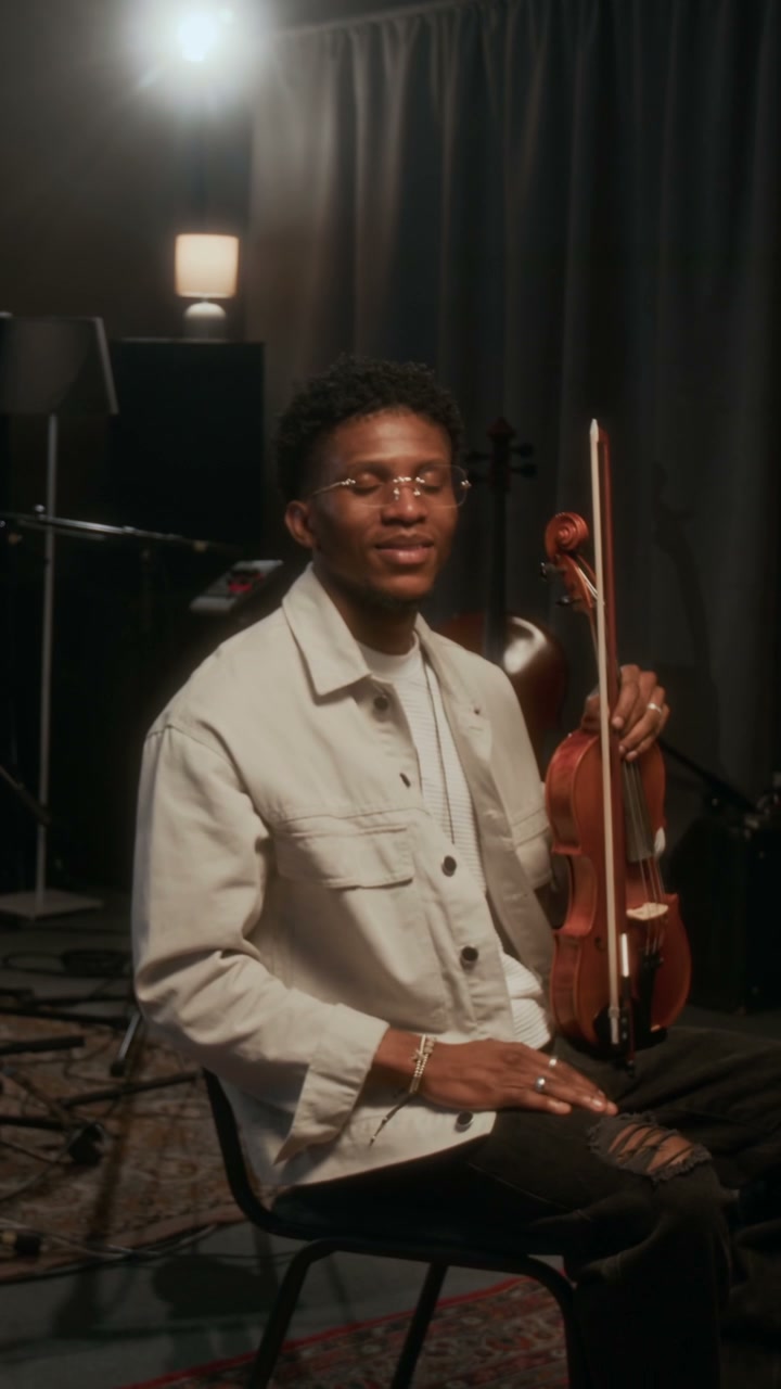 Violinist Smiling and Posing in Studio