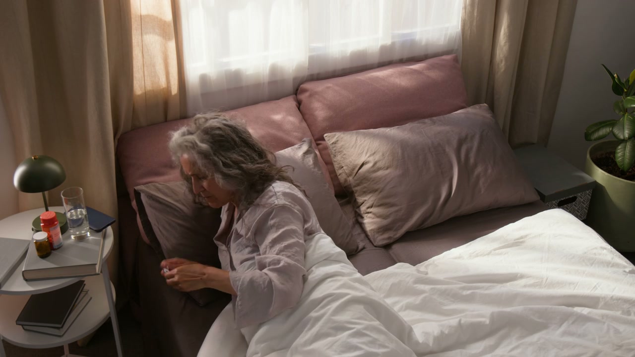 Senior Woman Morning Routine in Bed