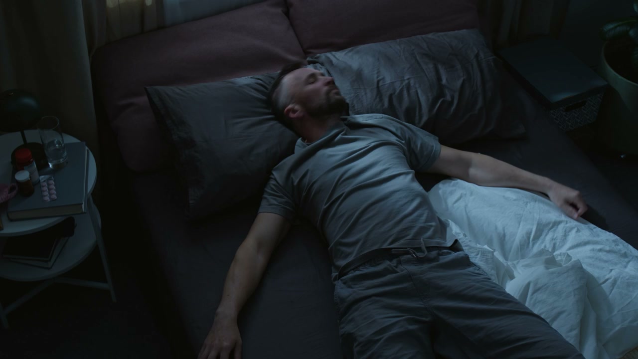 Time-lapse of Restless Man Tossing in Bed