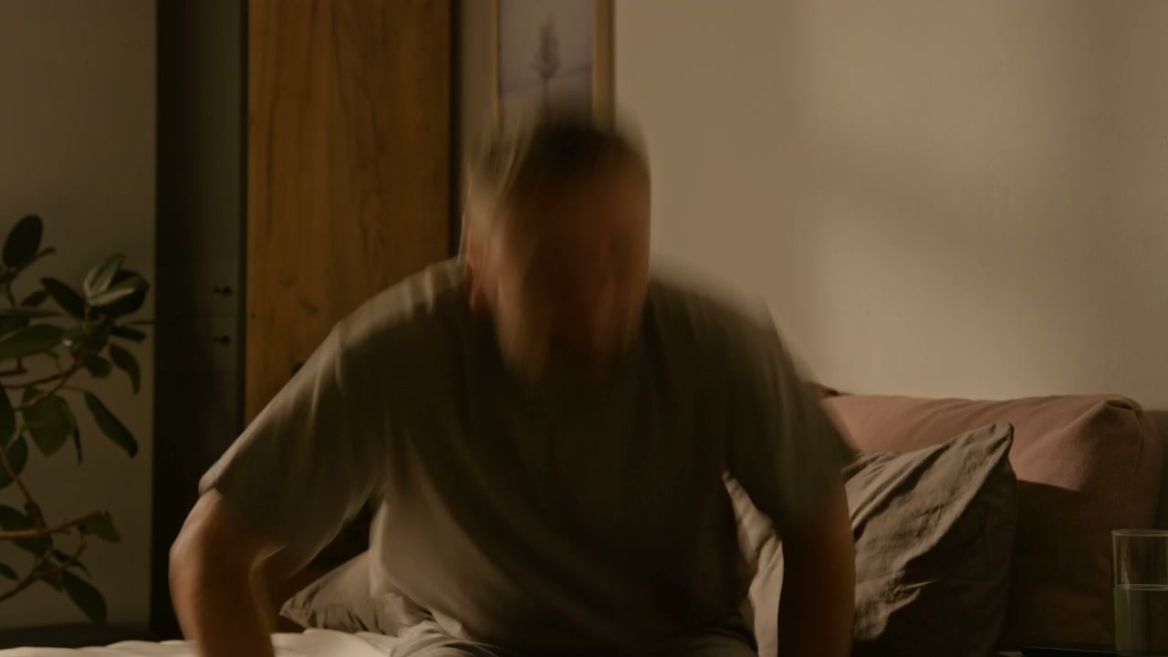 Time-Lapse of Man Working Late in Bed