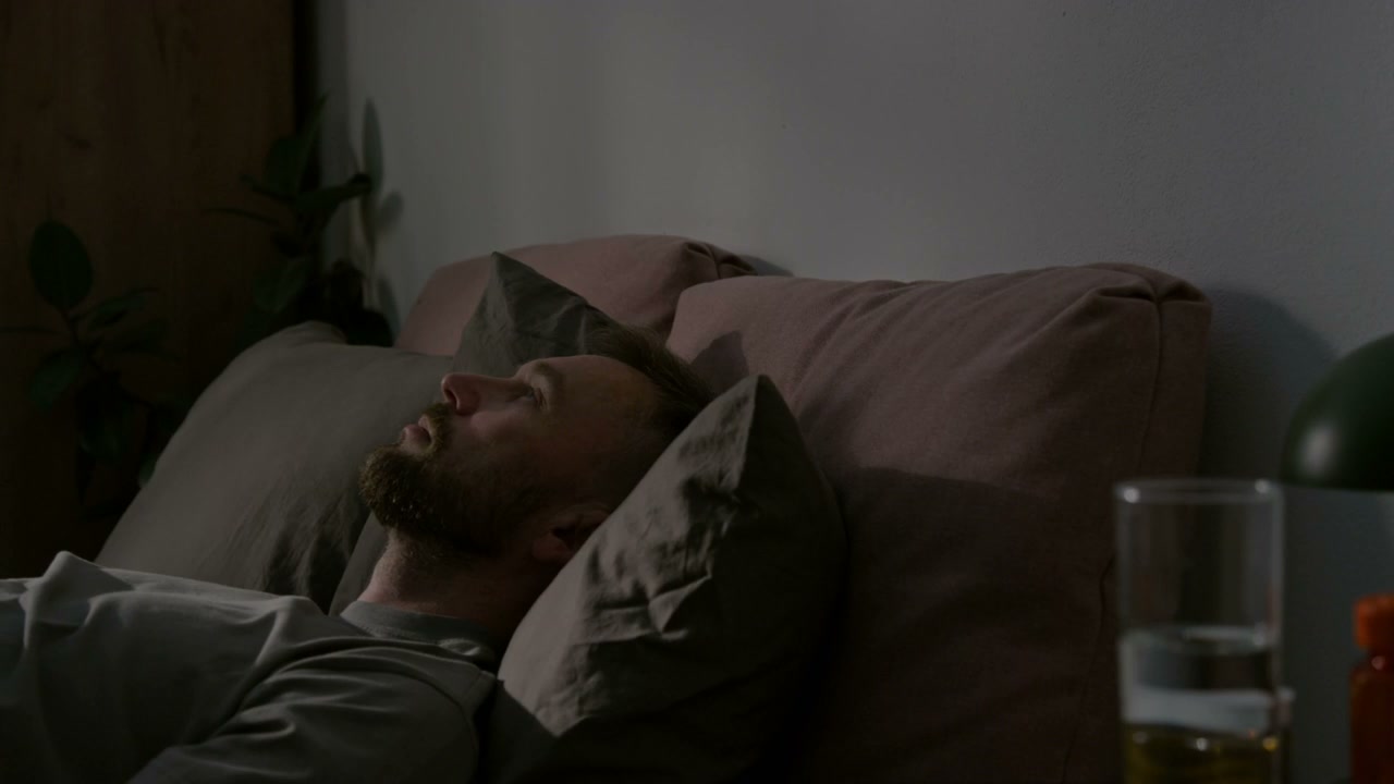 Sleepless Man in Bed at Night Time-Lapse