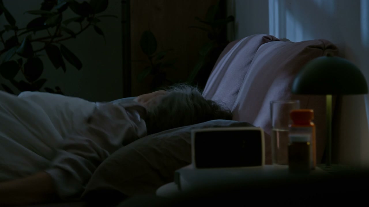 Elderly Woman Struggling with Insomnia at Night