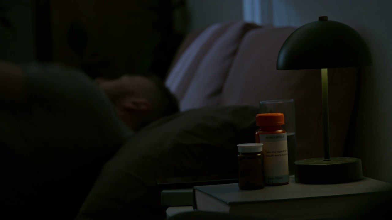 Man Tossing and Turning in Bed