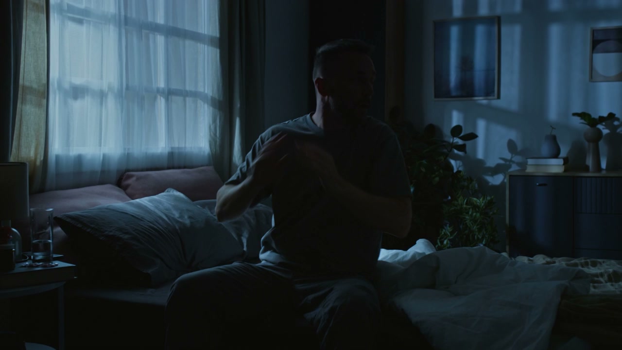 Man Waking Up in Distress at Night