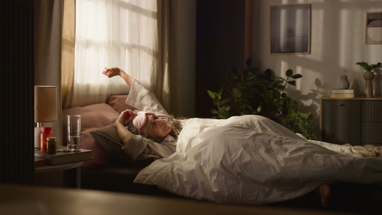 Happy Senior Woman Wakes Up in Morning Light