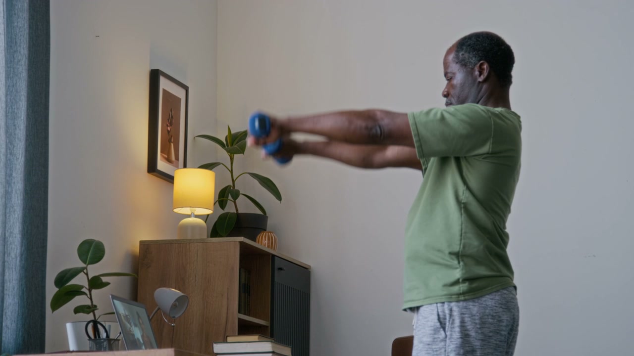 Senior Man Doing Online Dumbbell Workout