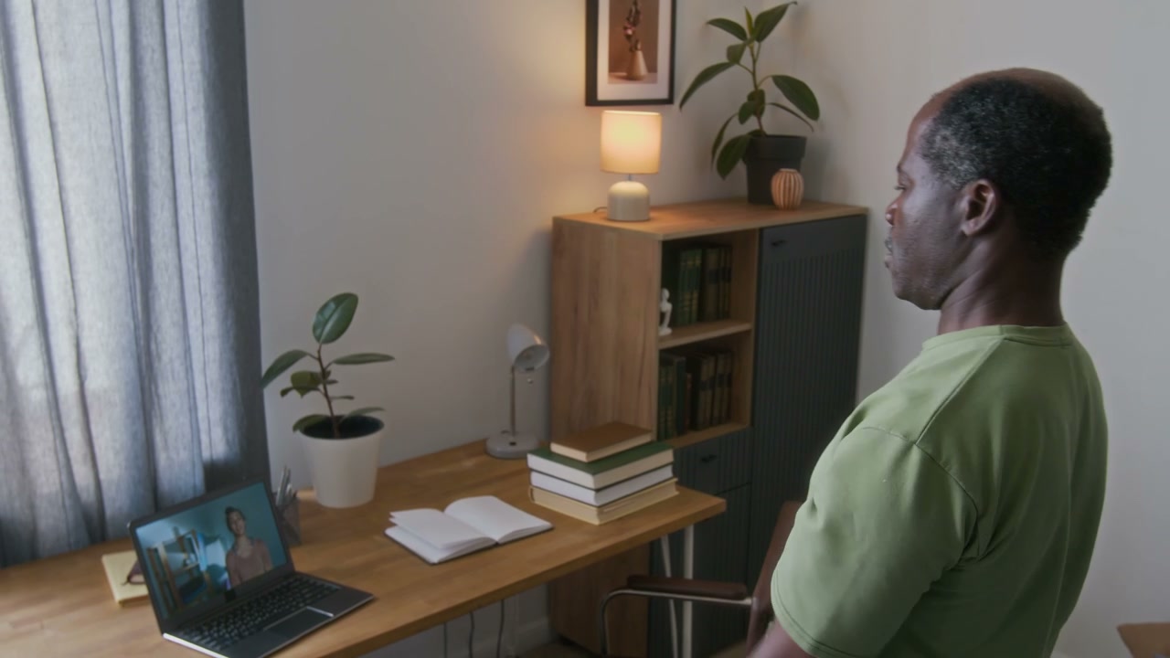 Senior Man Doing Online Dumbbell Workout