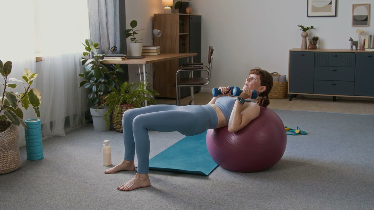 Senior Woman Doing Dumbbell Chest Press at Home