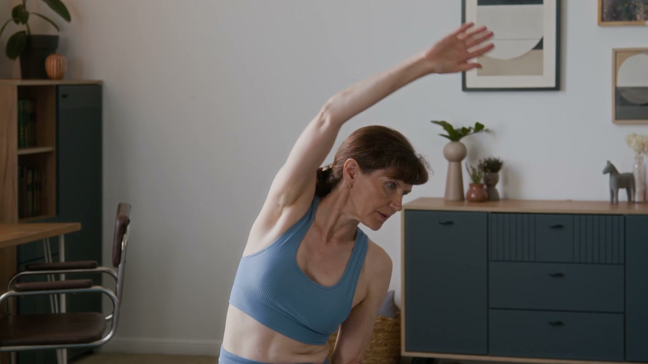 Senior Woman Doing Side Stretches at Home