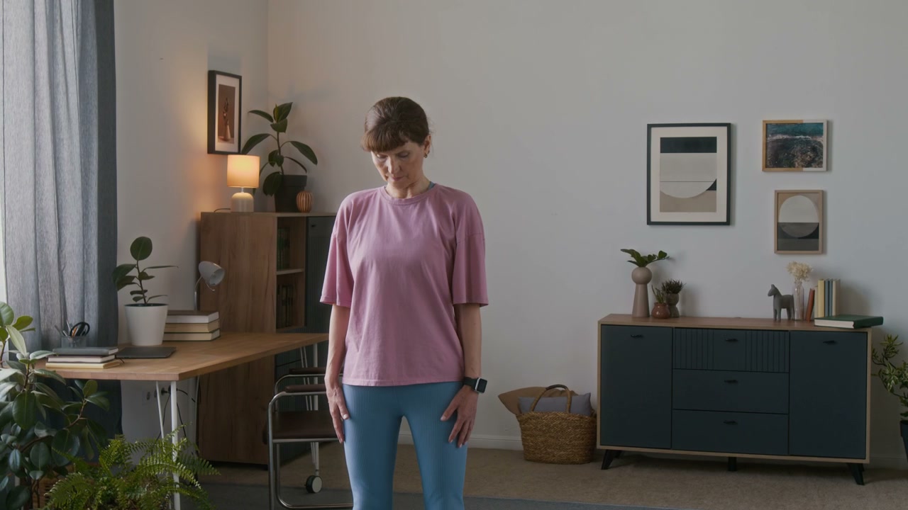 Senior Woman Doing Neck Stretches at Home