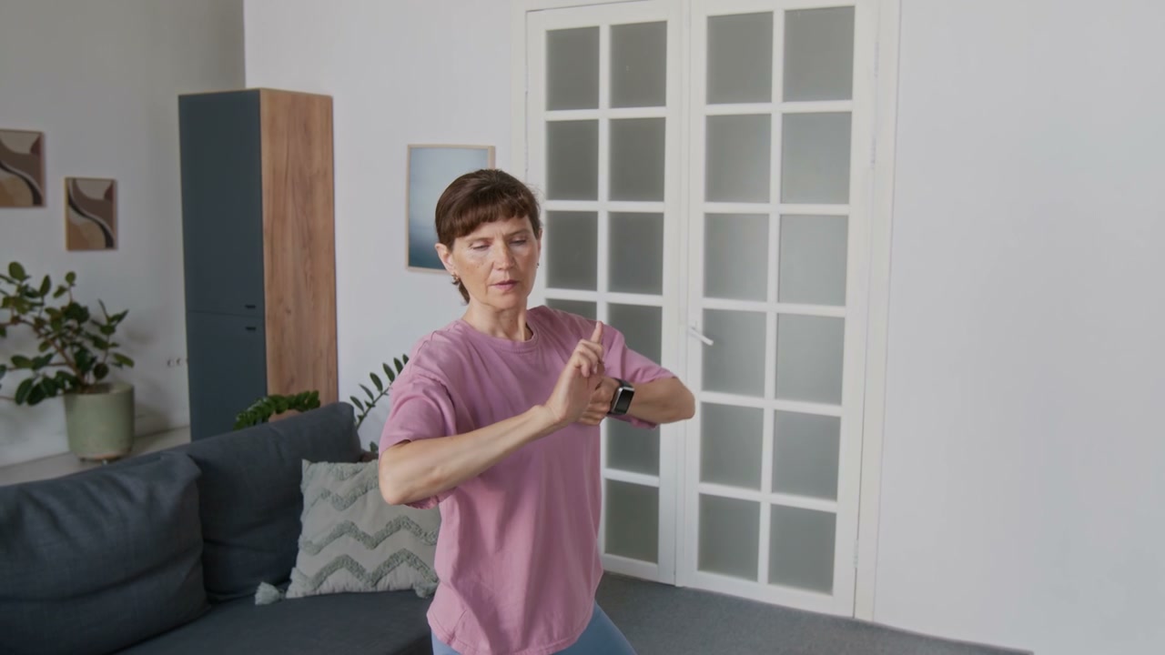 Senior Woman Practicing Tai Chi at Home