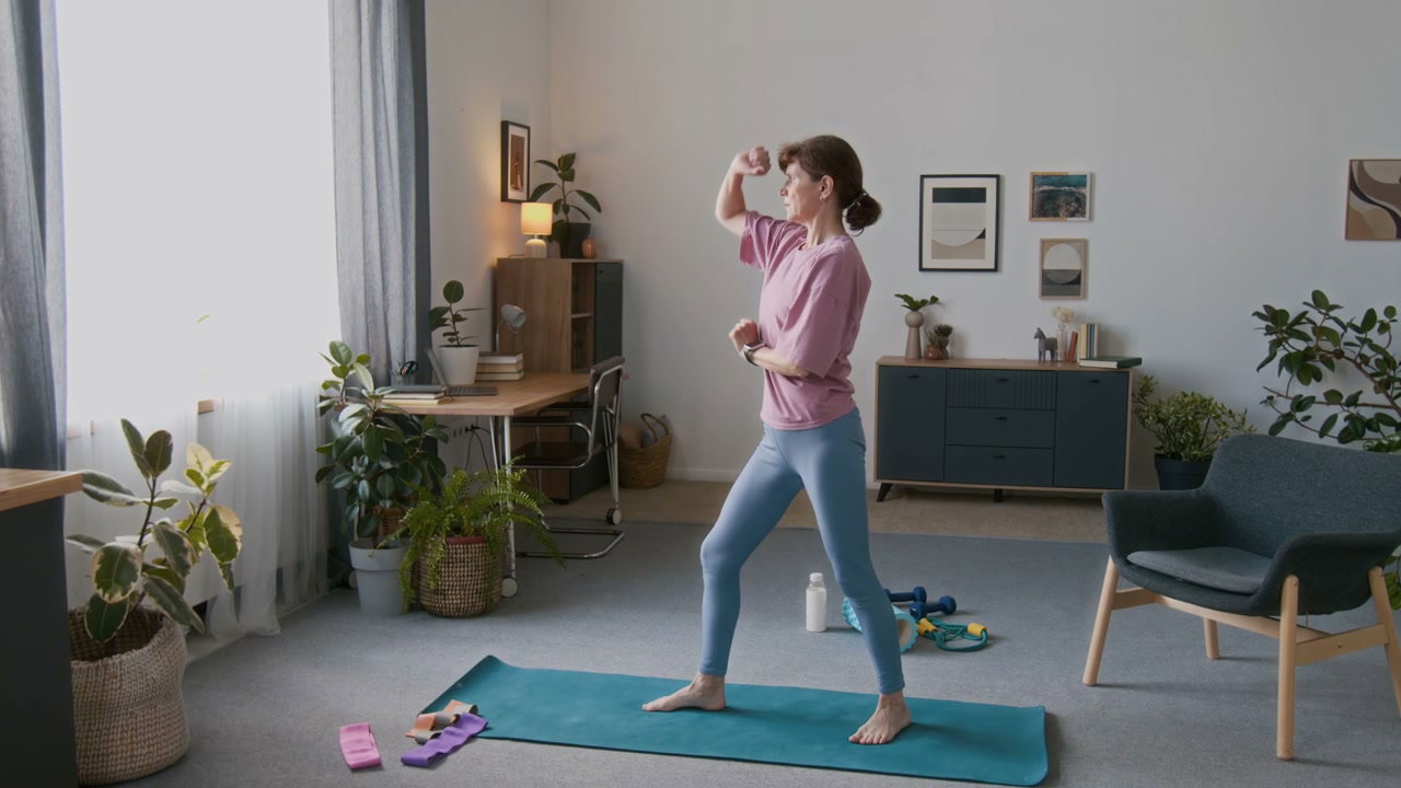 Senior Woman Practicing Tai Chi at Home