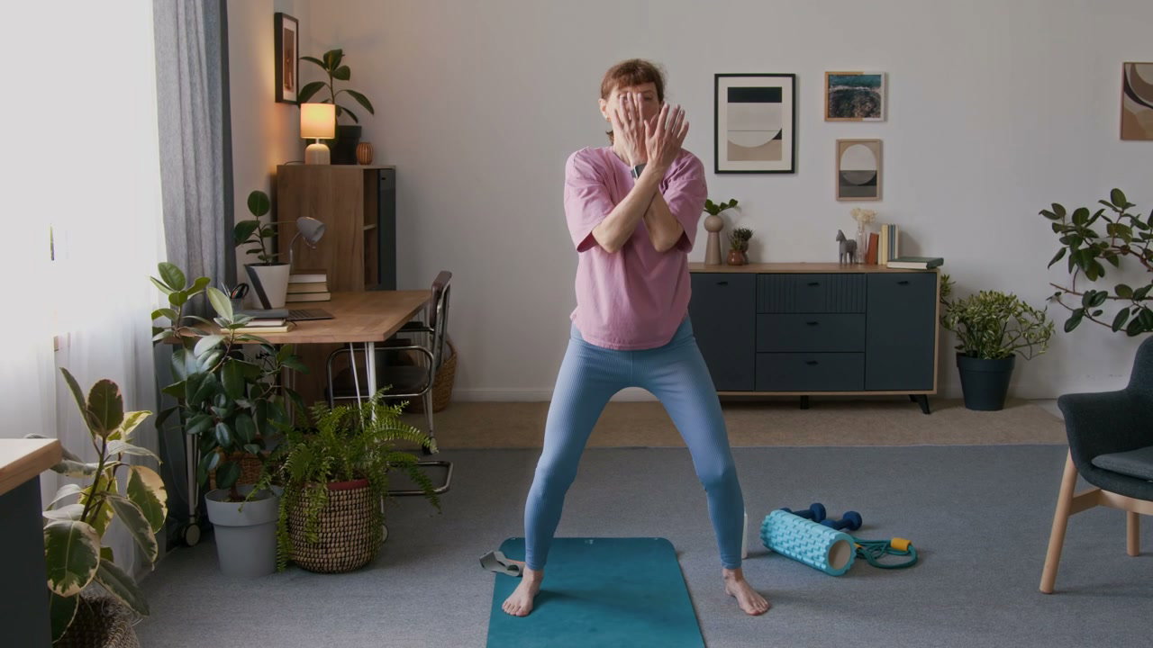 Senior Woman Practicing Tai Chi at Home