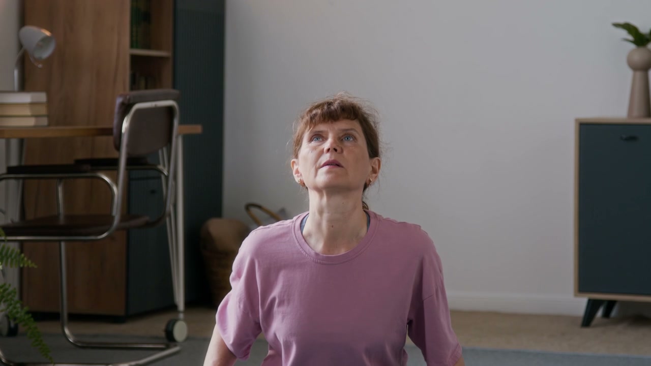 Senior Woman Stretching at Home