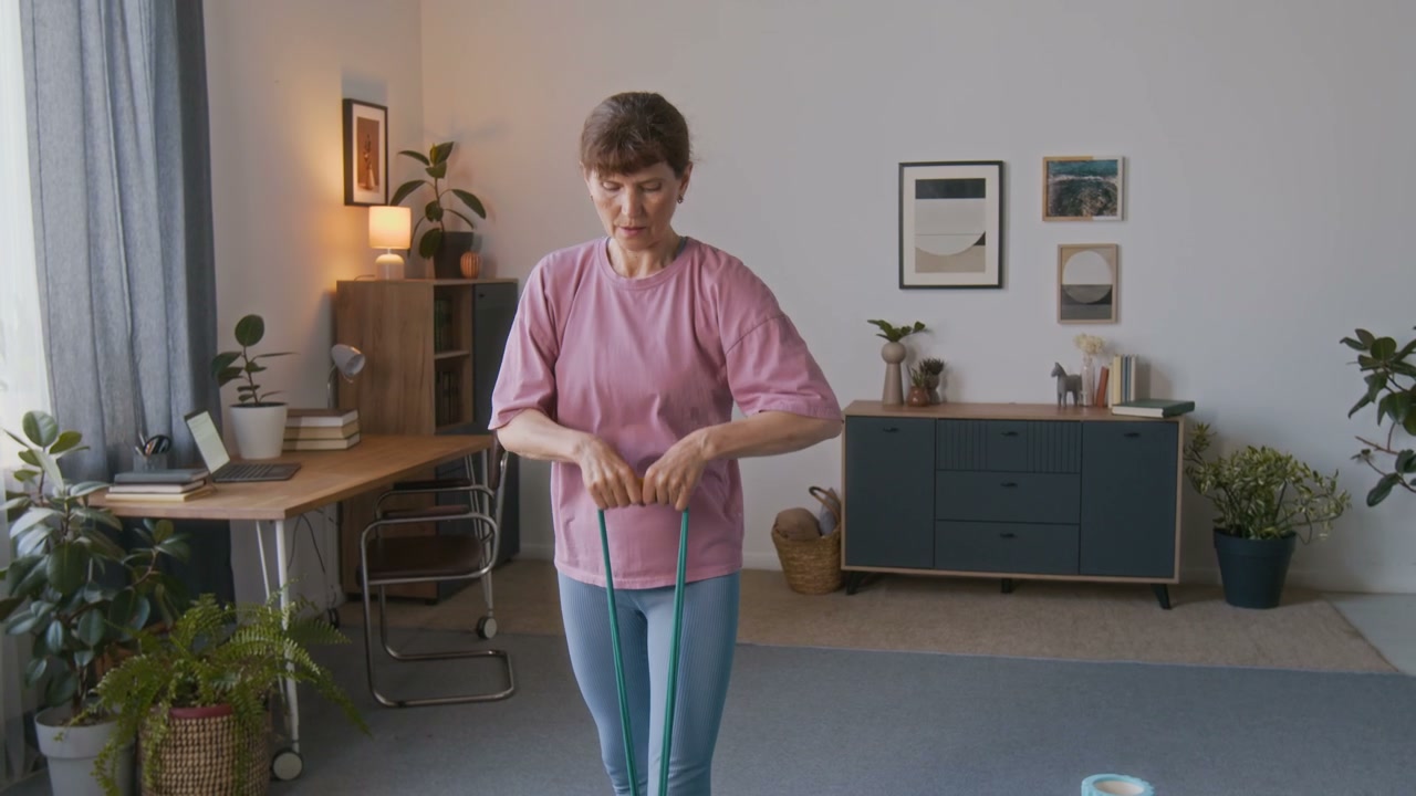 Senior Woman Exercising with Resistance Band