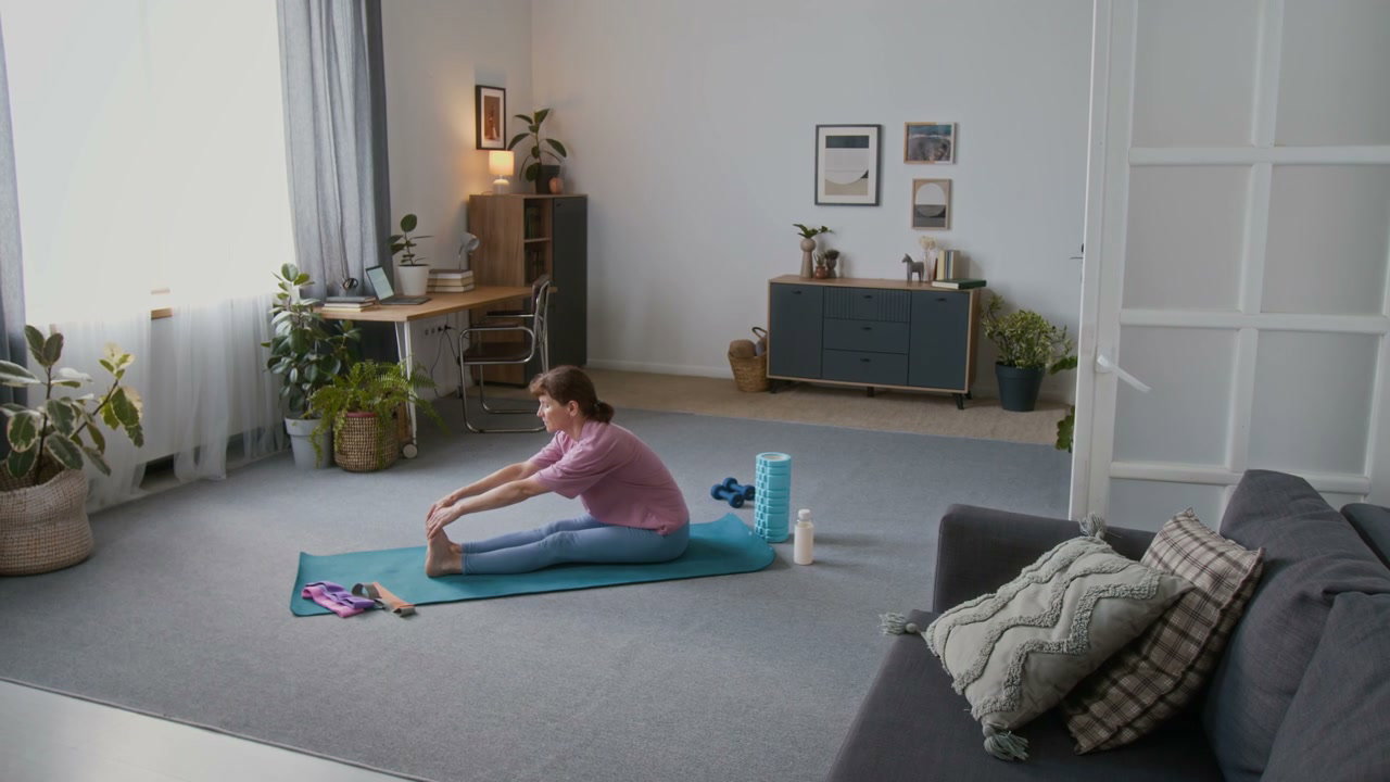 Woman Practicing Yoga at Home