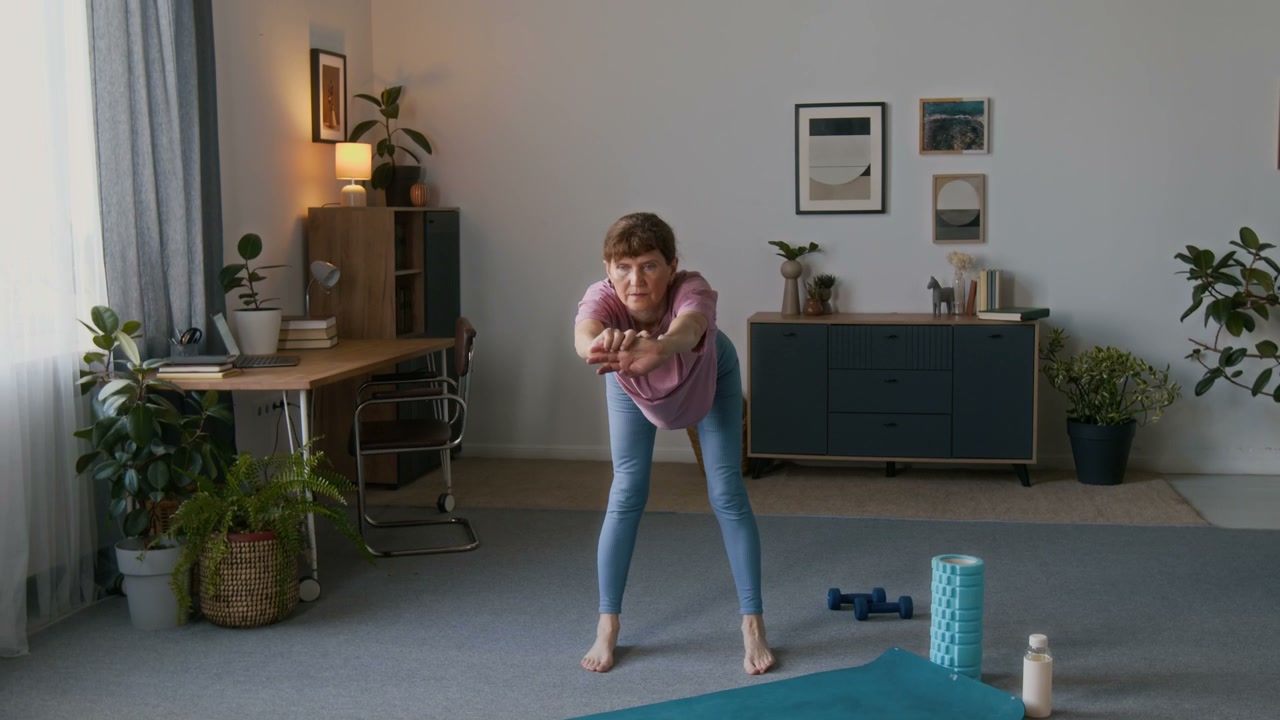 Senior Woman Warming Up in Living Room