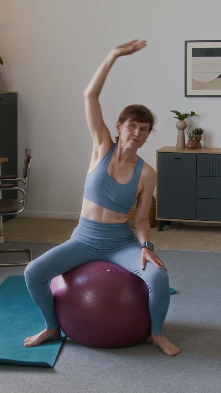 Senior Woman Stretching on Exercise Ball