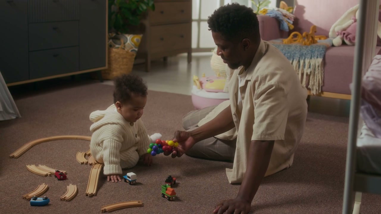 Father and Baby Playing with Wooden Toys